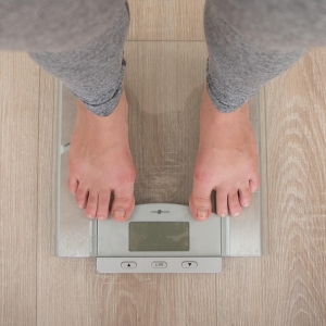 Feet standing on a scale